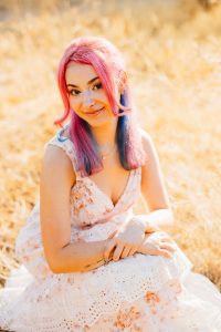 High school senior at sunrise along the Salt River at Coon Bluff, Arizona, lit by warm golden backlight